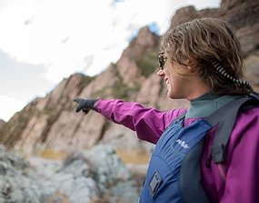 A woman points out to the river in Jackson Hole