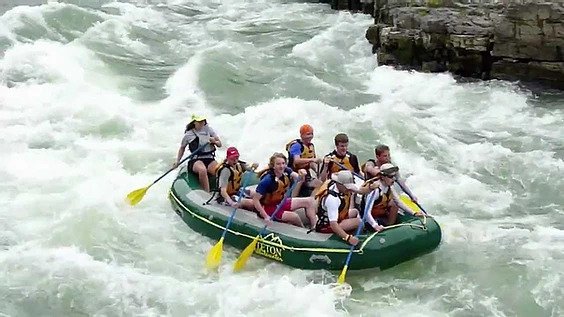 A group rafts down a rapid on the Snake River in Jackson Hole