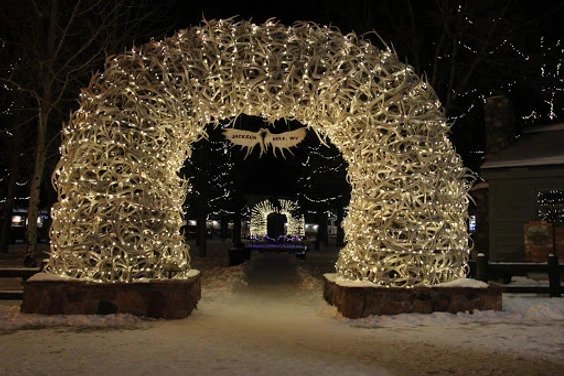 An archway of christmas lights in downtown Jackson Hole