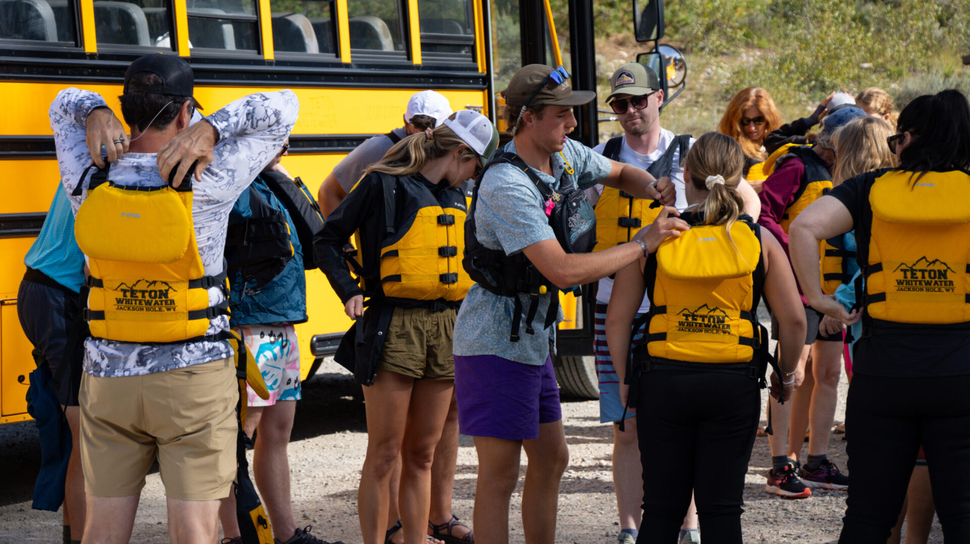 fitting lifejackets for a jackson hole whitewater rafting trip